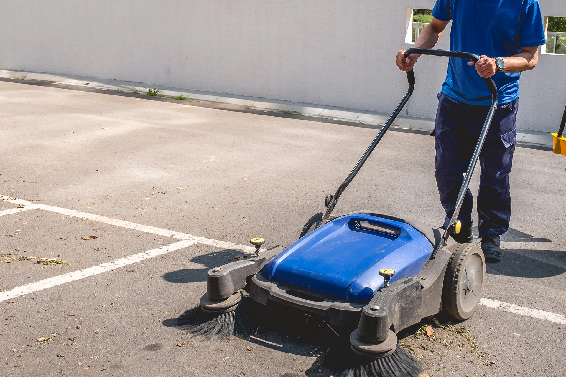 Professional cleaning team maintaining a commercial parking area