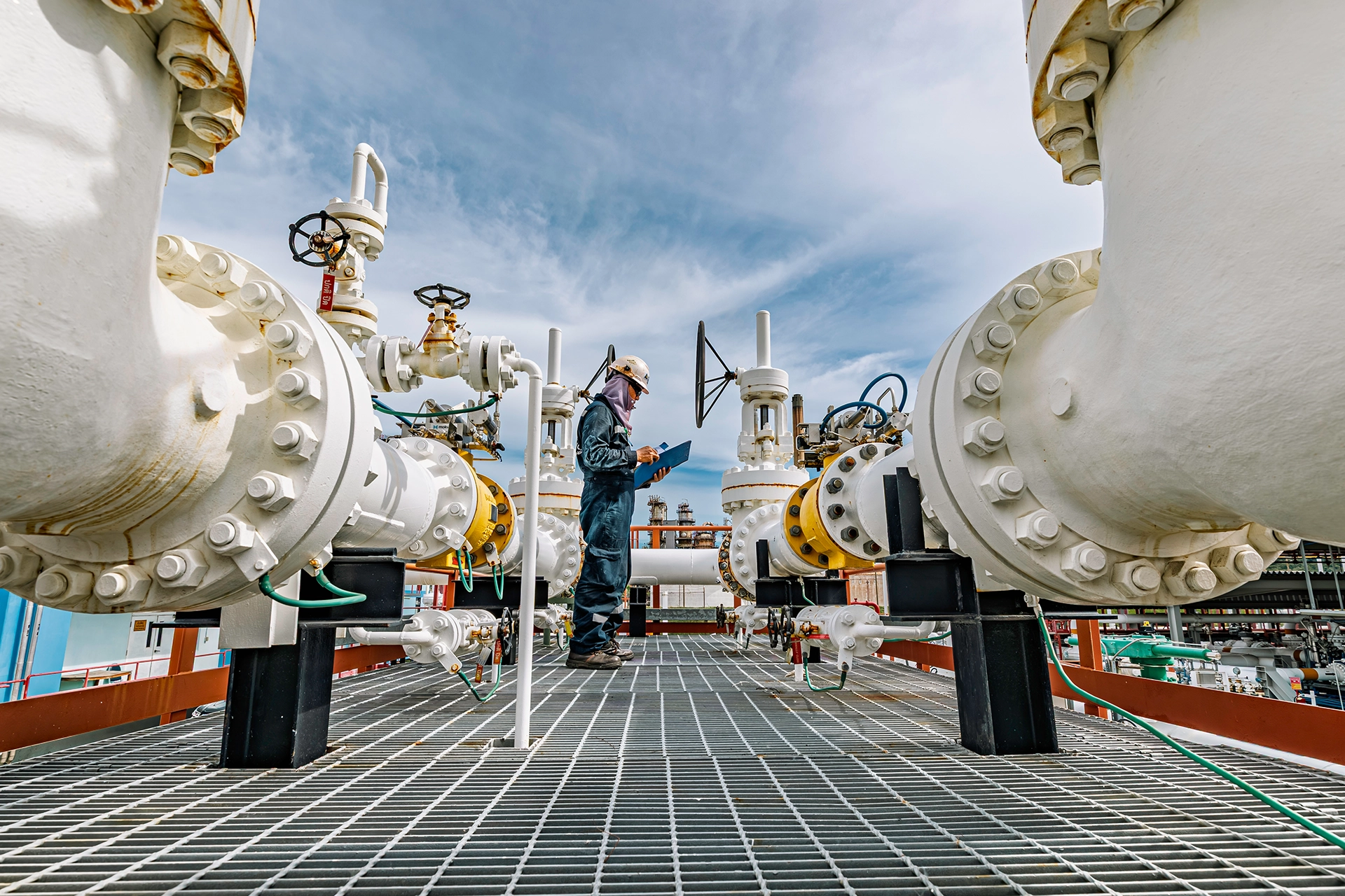 Technician repairing an industrial pipeline