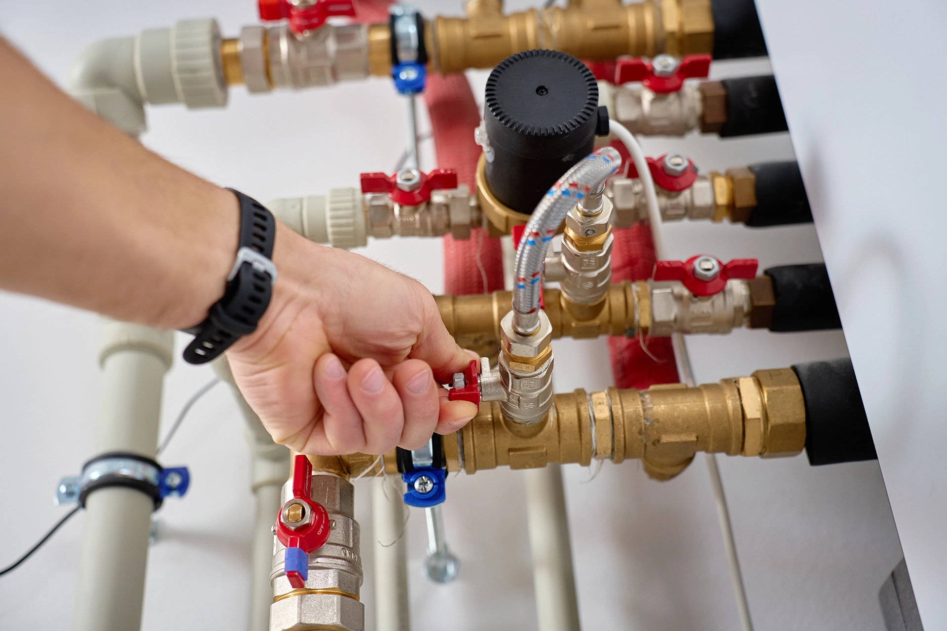 technician installing an industrial valve on a pipe system